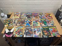 Table displaying 21 comic books of Spider-Man arranged in three rows featuring various editions and cover art.