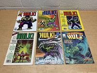 Photo showing six Hulk comic magazines from the early 1980s arranged in two rows on a table.