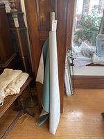 Full view of the vinyl material roll standing upright showing the length and width of the roll.