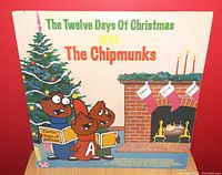 Front cover of 'The Twelve Days of Christmas' vinyl album featuring The Chipmunks characters in a Christmas setting.