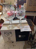 Two Bohemia crystal goblets, large and small, shown on original Bohemia box labeled Silver Lace six 8oz wine glasses.