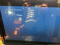 HP Pavilion 21 TouchSmart All-in-One PC screen showing 'Activate Windows' notification.