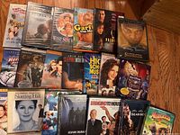Photo showing assorted DVDs including My Blue Heaven, Under Siege, West Side Story, Garfield The Movie, The Sixth Sense, Hercules, The Count of Monte Cristo, Perfect World, High School Musical Extended Edition and others