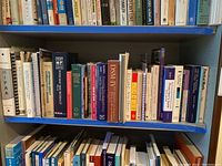 Shelves filled with a variety of medical and psychology books, arranged side by side. Includes books on psychology, medical laws, manuals, and therapy techniques.