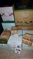 Multiple Hallmark Kiddie Car Classics collectible boxes stacked together showing various package designs and labels.