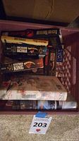 Collection of Stephen King and Richard Bachman books stacked in a crate showing various titles and worn covers.