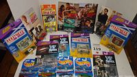 Overview of all diecast cars in original packaging themed after TV shows and movies, including Hot Wheels cars