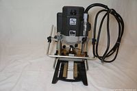 Front view of Black & Decker Elu plunge cut router showing the base, plunge mechanism, and power cord.