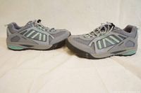 Side view of both gray Teva trail sneakers showing the outer profile and sole design.