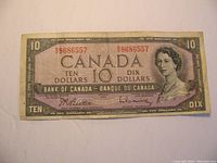 Front view of 1954 Canadian $10 bill showing Queen Elizabeth II, serial numbers, and denomination markings.