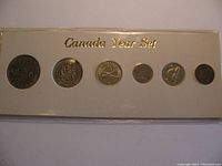 Six Canadian coins mounted in a white card holder labeled 'Canada Year Set' in gold lettering.