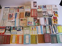Overview of assorted baseball cards and puzzle pieces laid on table showing the wide range of sets and players.