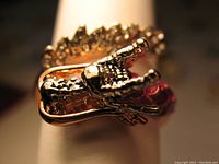Close-up image focusing on the detailed dragon head and claws of the ring showcasing its texture and design.