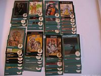 Photo showing assorted TSR Advanced Dungeons and Dragons trading cards from 1992-1993 sets, with visible characters and items such as Casimir, Rashad al-Anwar, Powell, and Fredresha in excellent condition.