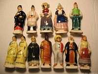 Twelve ceramic figurines from Canadian Tender Leaf Tea 'People of Many Lands' series arranged in two rows on a white background.