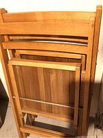 Photo of wooden folding chair showing wood slats and folding mechanism.