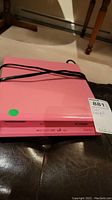 Front view of the pink Electrohome DVD player showing model and color