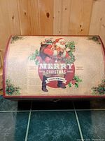 Front view of Christmas chest with curved lid and vintage Santa design