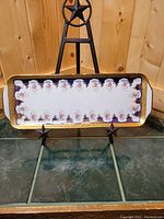 Full view of rectangular porcelain tray showing floral pattern and gold border.