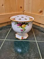Front and side view of the Old Country Roses vase showing floral pattern and gold trim.