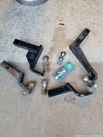 Overview of multiple towing hitch ball mounts and hitch balls, including packaged set