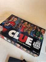 Closed game box with cover art showing characters from The Big Bang Theory and Clue logo.