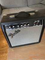 Front view of Fender Frontman 15G guitar amplifier showing controls and branding.