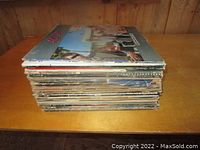 Stack of record sleeves viewed from the side; shows thickness of lot