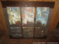 Front view of the large three-panel abstract wall art mounted on a dark wooden backing.