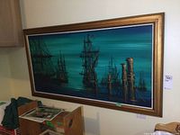 Full view of the large painting in frame, showing maritime scene with ships and wooden posts on water under a teal to blue sky.