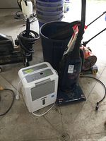 Both the Dirt Devil vacuum and the UberHaus dehumidifier are shown on the floor alongside other items.