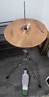 High-hat stand with two 14-inch Zildjian cymbals shown mounted on the tripod stand with foot pedal.