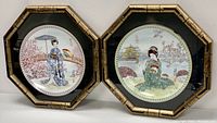Pair of Japanese themed collector plates displayed side by side in octagonal shadow-box frames with bamboo-style edges, showing full view of both plates and frames.