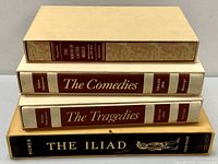 Side view of spines showing titles and slipcases for four classic books in the Heritage series.