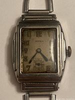 Front face view of vintage Birks wristwatch showing rectangular dial with Arabic numerals and worn face