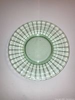 Top-down view of the uranium glass plate showing ribbed pattern and circular shape