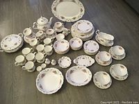 Overall arrangement of dinnerware set displayed on floor