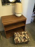 Shelf unit with swing top, MCM lamp on top and foot stool in front