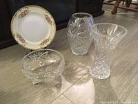 All items together showing vases, footed bowl, and hand painted plate with floral design and gold trim