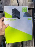 Closed white and lime green My Book external hard drive box with Western Digital logo, approximately 10 inches in size.