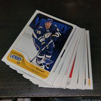 Stack of Victory hockey cards with Chris Stewart card on top, showing player in blue team jersey with Victory logo.