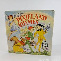 Front cover of Pixieland Rhymes children's book showing pixie characters and woodland creatures, colorful mid-century illustration by Rene Cloke.