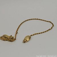 Full view of the cat and mouse bookmark showing chain connecting two figures