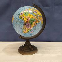 Front view of the plastic globe pencil sharpener showing Africa, Europe, and surrounding regions.