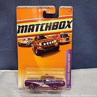 Front view of sealed Matchbox 78 Dodge Monaco police car on original packaging card with clear plastic blister.