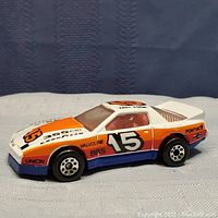Side view of the Matchbox Pontiac Firebird racer toy car showing decals and racing number 15
