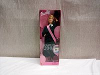 Front view of the Barbie Class of 2002 Special Edition doll in original box, featuring the doll in graduation attire and visible minor box wear.