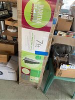 Boxed artificial Christmas tree with Martha Stewart Everyday branding and product details visible on packaging.