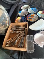 Box of Oneida silverware including forks, knives, spoons