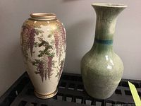Two ceramic vases side by side showing different designs and shapes.